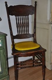 One of the two antique side chairs