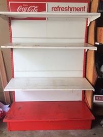 one of two coca cola metal display shelves