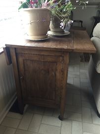 Antique drop leaf table/cabinet