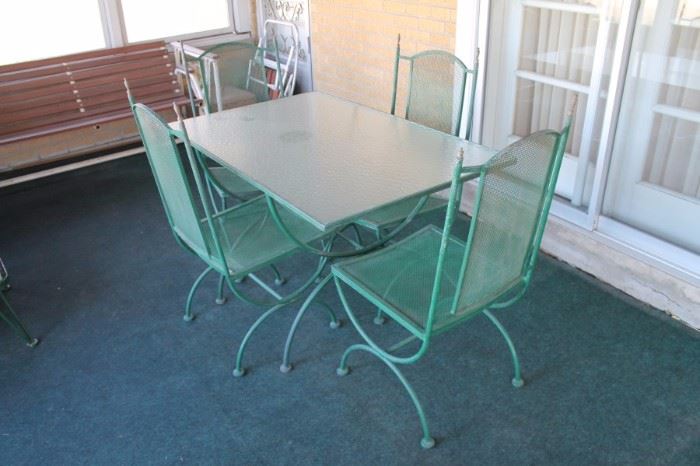 Mid century wrought iron patio table with 4 chairs