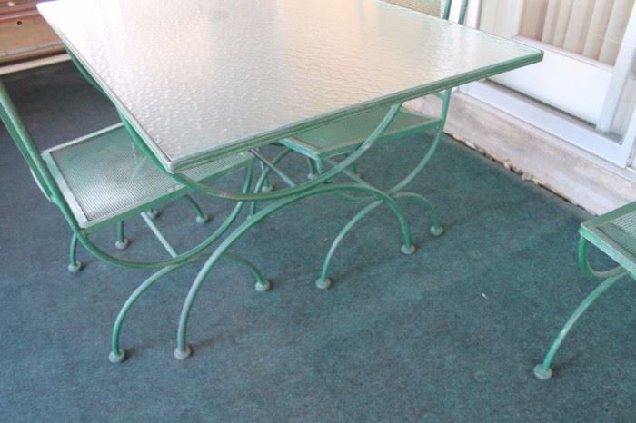 Mid century wrought iron patio table with 4 chairs