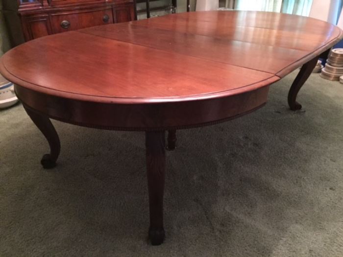 Wonderful craftsman-made walnut dining table -- came from "the banker's house" (family name was Stauers) in Natchez.  This photo shows 2 15" leaves (83" long at this point); 2 additional leaves make it 102" (9 feet!) 
