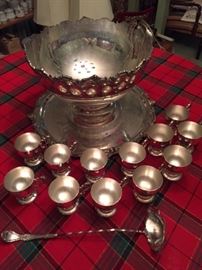 Silver punchbowl with 12 cups, ladle, and silver over copper tray.  From the "banker's" (Stauers) house in Natchez.