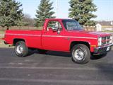 2007 in my own shop and it is now finally complete. Since the tank and pumps were gone when I purchased it, I proceeded in a different direction.
Exterior upgrades include updating the grill to dual headlights and chrome front bumper. I added Silverado trim and medallions. I finally located a pristine period correct bed that completed a C30 series pickup totally without rust. The paint is Dupont ChromaBase 3P0 Super Red V with 1D4 Titanium Silver accent stripes.
Being a former drag racer, I couldn’t help but add some pep to the 350 V8 with only 3029 miles. I also wanted to take a look inside the pan and it looked just like new – clean as a pin. Two sets of numbers are stamped onto the block, V0308USF and CDV114050.
I installed a Comp Cam Extreme Energy Hydraulic cam, 262 degrees – 270 degrees, 462/469 lift with hydraulic lifters. I installed roller rocker arms and drive it all with Acura drive adjustable timing gears.
Ignition is fired by 50,000-volt coil.
All of this is...