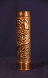 This is a rose vase made from a brass artillery shell.
