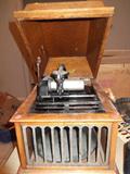 This is a "WORKING" graphophone made by Edison. We also have a large amount of cylinders to play on it. This is great for any antique collector or just for someone to bring back all the old wonderful memories!! This is a rare item that you must have!!