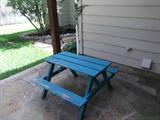 A kid size picinic table.