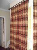 All draperies are custom and available for sale.