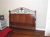 Queen head and footboard with wooden side rails.
