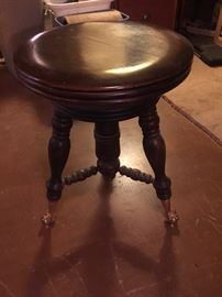 Piano stool, glass footing.