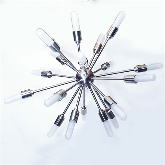 Mid Century Modern Sputnik Pendant Chandelier: A Mid Century Modern Sputnik pendant chandelier. This silver tone chandelier features a Sputnik design with eighteen arms extending out from a central globe. The chandelier is connected to the ceiling by a drop rod and includes wiring. This fixture is untested.