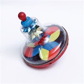 Vintage Carnival Pattern Spinning Top: A vintage spinning top. This piece is composed of metal and has been painted in colors representative of an early 1900s carnival with a color palette of bright red, white, yellow and white with a finial handle shaped similar to a clown nose. There is no maker’s mark present on this piece.