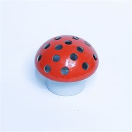 1968 Vandor Imports Ceramic Mushroom Potpurri Holder: A 1968 Vandor Imports ceramic mushroom potpurri holder. This holder features a red ceramic mushroom-shaped top with pierced holes. This includes a white cylindrical ceramic base marked “Vandor Imports 1968.”
