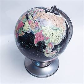 Black Ocean Globe by Replogle: A globe from the company Replogle. This piece features a matte gray metal frame and base with a unique feature of having the oceans colored jet black. The maker’s mark is present on the side of the globe in one of the oceans.