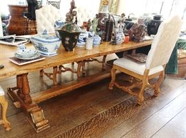 very long French farm table with 10 newly upholstered chairs