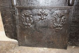 Large and Small French Fireback Plates.... Small Plate- (H 23in x W 19in) 18th Century, Two Royal Lion Crests w/ Fleur de Lys at Center.  Larger Plate- 17th Century French with Date and Name