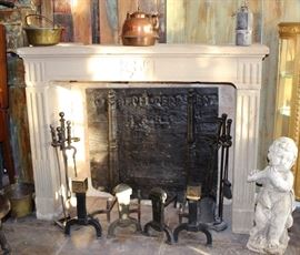 Large Hand-Carved Antique 18th Century Imported French Sand Stone Fireplace- Length 60" x Height 48" x Depth 20"- Three SOLID Blocks For Legs and Mantle + Two Corner Blocks @ Top Left and Right Sides--- Original Authentic Style of Carving Stone Fireplaces Before Use of Multiple Pieces and Veneers Glued Together To Lower Cost and Reduce Risk of Mistake During Carving...VERY Special and Masterfully Built Fireplace, In ONE Chateau in the French Countryside Since Original Build and Installation (Ca1750) Until Be Exported Directly To and Exclusively For Our Gallery (Like All Our French Pieces---Single Owner Piece For Almost 300 YEARS!!!; Fireback Ca1685; StoneCherub Ca1880 to 1900; copper kettle + brass cauldron- both 18th Century; 2 Andirons + 2 Fire Tools- by Bradley Hubbard, Cahill, Howes Co-- Ca 1860s-1880s