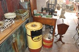 1951 Electric Singer Sewing Table Machine- Comes With Both Original Manuals, Original Button Machine and Extra Parts, and Original 1950s Sewing Supplies. FULLY FUNCTIONAL.  (To The Right Side) A Sewing Pedestal Box, Circa 1920s, In Near-Perfect Condition.  Oil Drum and Gas Can- ALL ORIGINAL