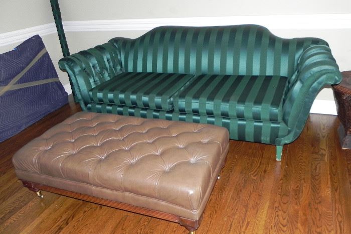 Custom upholstered sofa with roll of matching material.