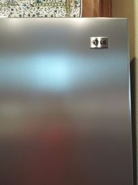 LG side-by-side titanium stainless finish refrigerator built-in ice maker and water dispenser