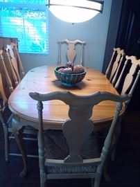 Oval solid Pine dining table French country style complete with 6 solid Pine fiddleback style chairs with Rush bottom seats and two extension boards. Can sit up to 10 people comfortably