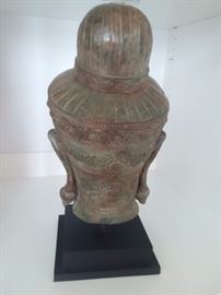 Bronze Buddha head on black composite base purchased from Gump's San Francisco