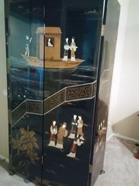 Chinese four paneled free-standing lacquered wood screen
