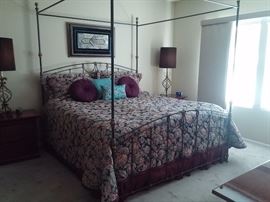 Handmade iron and Brass canopy  king size bed. Designer The Brass Madien. Houston Texas custom-made quilt bedspread with matching pillow shams and assorted throw pillows.
