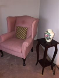 pink wing back chair and table