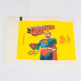 1965 Topps Superman Cards 5 Cent Wrapper: A 1965 Topps Superman 5cent wrapper. The wrapper features advertising for the Superman T.V show during the 1960s and the original packs were sold for 5 cents each. Collaborated between Topps and National Periodical Publications.