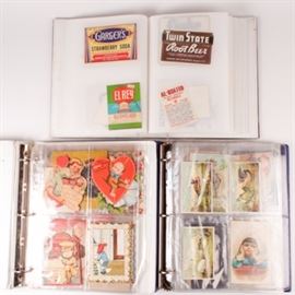 Collection of Vintage Labels, Valentines, Photos and Tobacco Cards: A collection of vintage labels, valentines, photos and tobacco cards. The collection includes three filled binders of various paper ephemera featuring valentines cards from the early 20th century. A book of vintage beverage and advertising labels from the early 20th century. Also included is a book with various post cards and tobacco cards featuring New England.