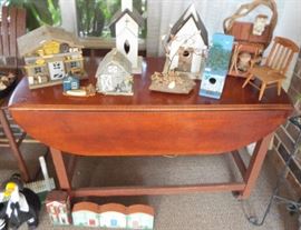 Drop-leaf table full of bird houses