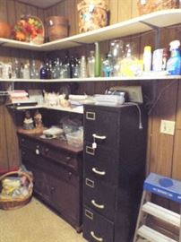 File cabinet & lots of vases & vintage bottles
