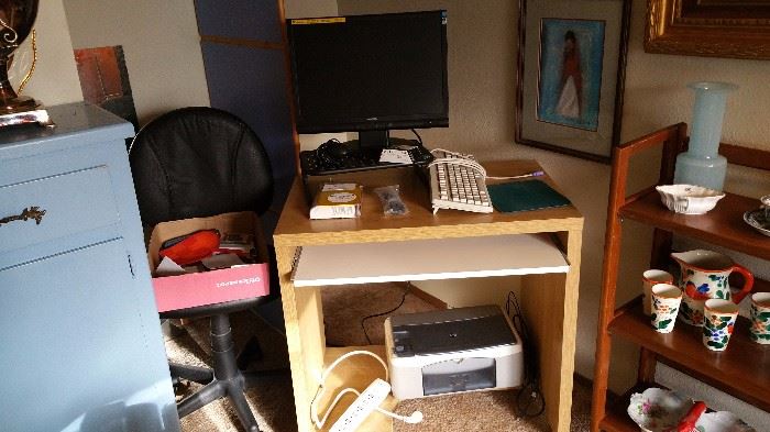 functional desk, office chair, computer monitor and printer