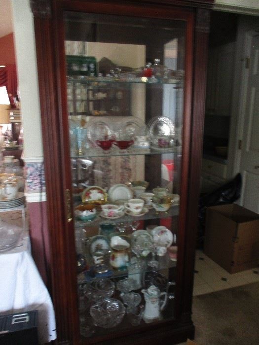 A NICELY SIZED CURIO CABINET TO FIT THE SMALLER WALL. VERY NICE PIECE.