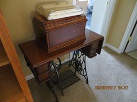Vintage Singer Sewing Machine with original cover.