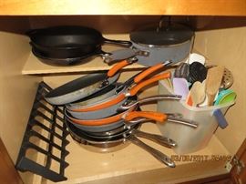 Lots of frying pans and other pots