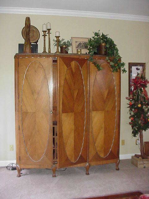 Three door armoire with oval parquetry inlaid panels