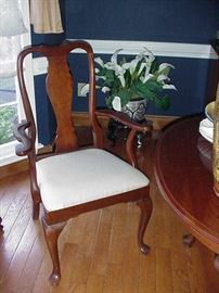 One of the Queen Anne mahogany dining chairs--2 arm chairs and four side chairs