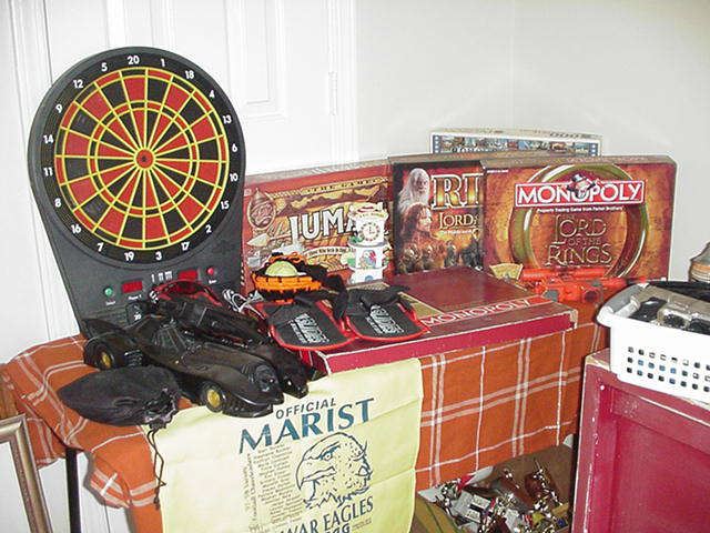Games--several editions of Monopoly; dart board; Bat Mobile; Jumandi, and 1000 piece puzzle