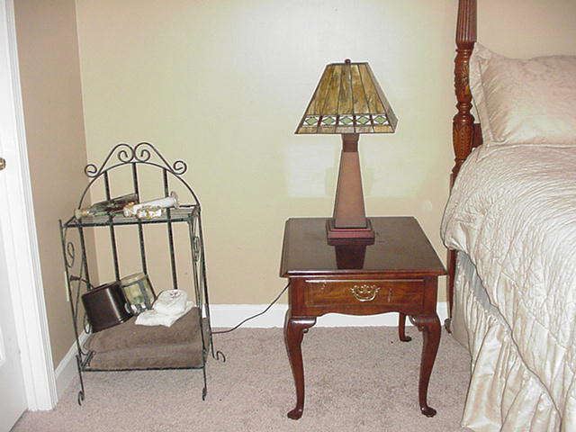 Metal towel stand; mahogany night table with drawer; Lamp with stained glass shade