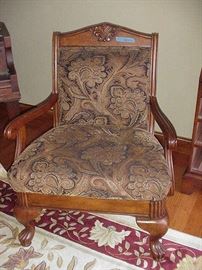 Arm chair with ornate upholstery pattern
