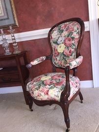 Gentleman's Victorian Chair. Floral fabric on inside with a solid yellow fabric on back.