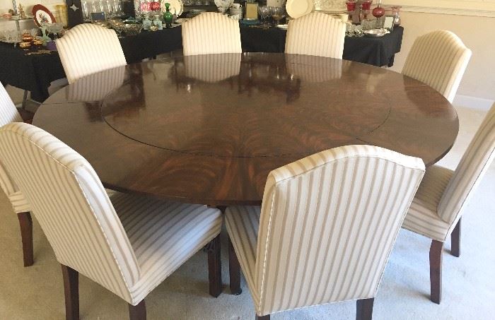 E J Victor Regency Dining Table with perimeter leaves:  60" dia. without leaves, 84" dia. with leaves. Mahogany.
