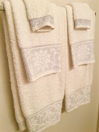Towels and sheets and other bed linens in like-new condition in this sale