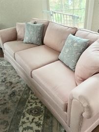 Pale pink three-cushion sofa