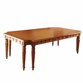 Wood Dining Table with Leaves: A wooden rectangular dining room table with two leaves. This C-cut edged table features eight spiral hand carved legs and arrow feet. The table also features drape and floral detailing craved on the side. There are custom made tan table top pads that are included.