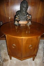 CLOSEUP OF END TABLE & STATUES