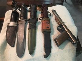 Bayonets and a 1930s Benjamin pellet pistol. 