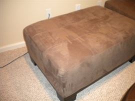 Quality L shaped sectional with matching ottoman. Also Leather round ottoman. Solid wood pine entertainment center with three seperate shelving units/book shelves.